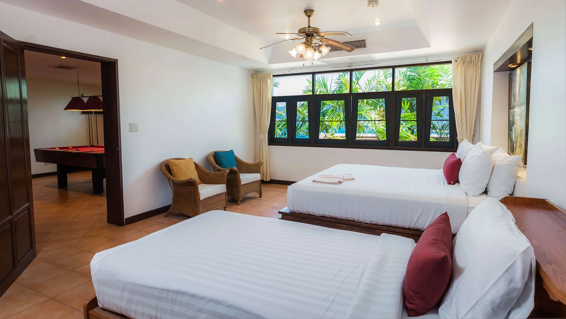 The fifth bedroom, a king and a single bed, opening onto the media room and pool table