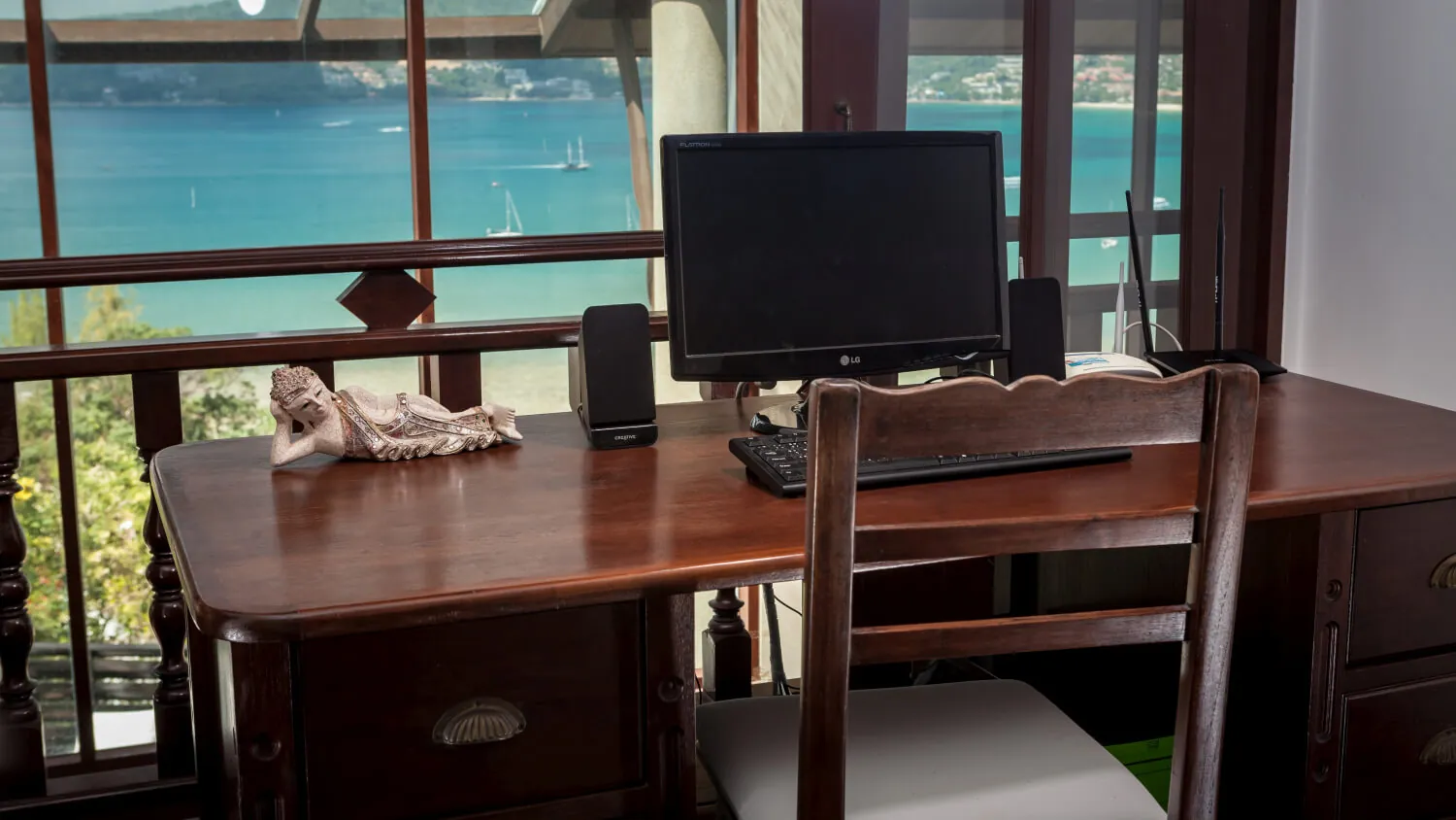 The villa's desk and broadband workstation, set at a window over Patong Bay
